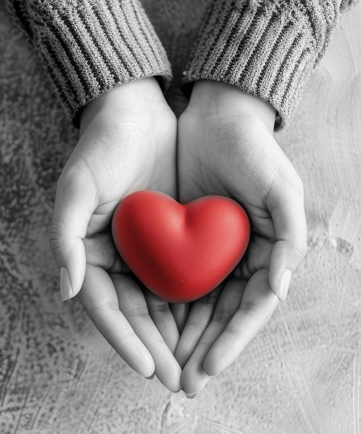 Two Hands Gently Holding a Heart, Symbolizing Unconditional Love and Deep Care for Others